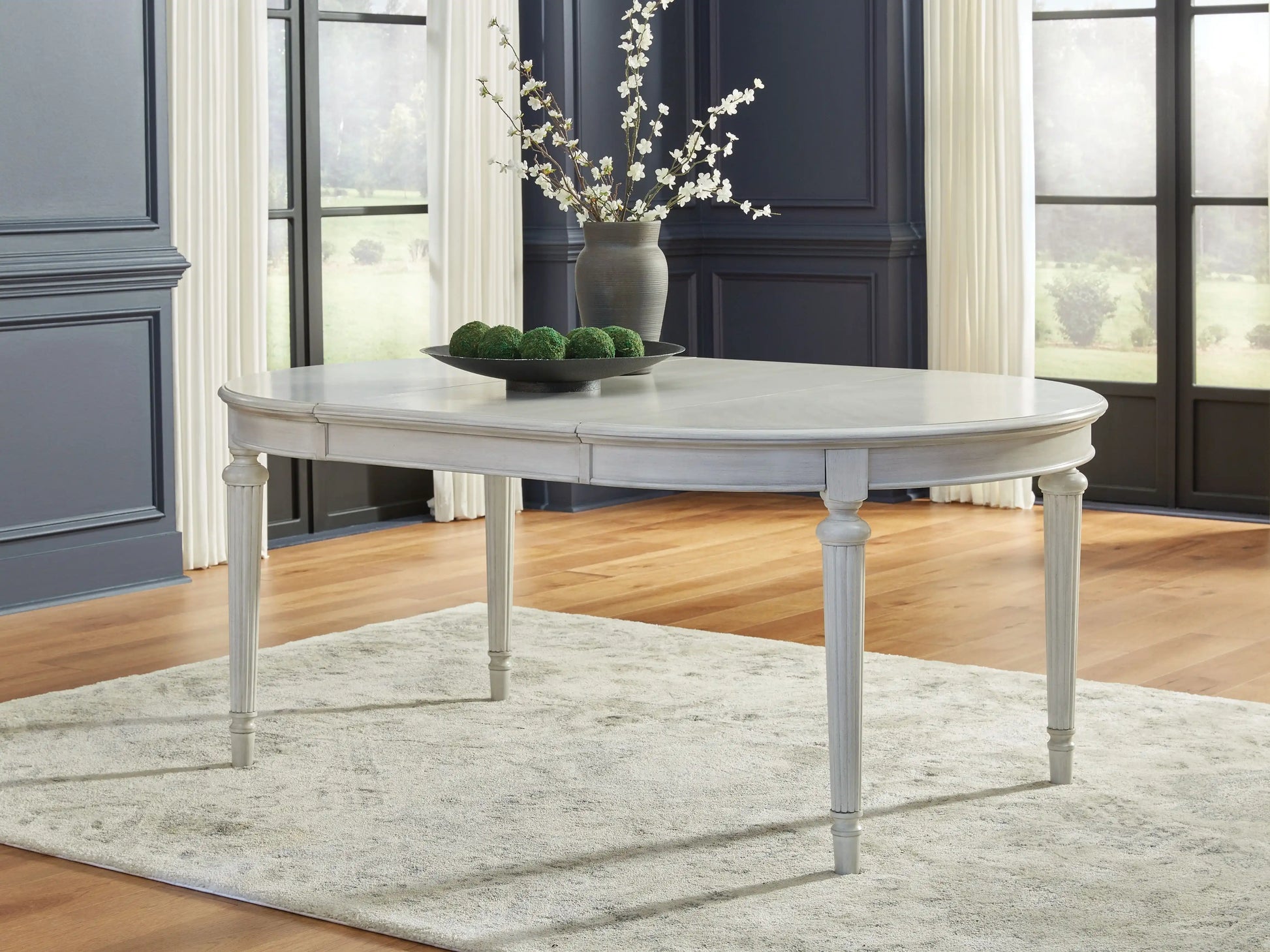 Montelaine - Oval Dining Room Extension Table - Antique White - Best Buy Furniture